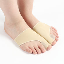 Load image into Gallery viewer, Pair of beige bunion corrector toe splints worn on both feet, side angle