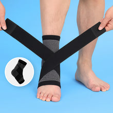 Load image into Gallery viewer, Hands wrapping black grey Compression Ankle Sleeve straps around bare ankle