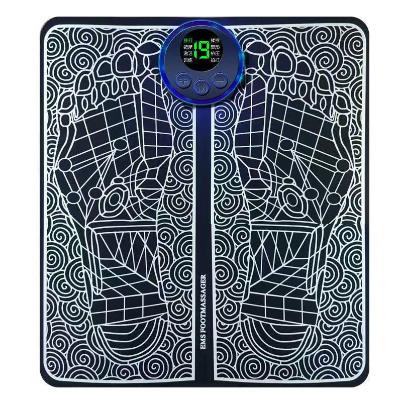 EMS Foot Massage Mat flat lay showing black patterned surface and illuminated LCD controller