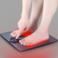 EMS Foot Massage Mat with red stimulation overlay showing pressure points on bare feet