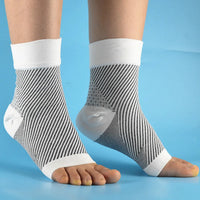 White black striped Foot & Ankle Sleeve Compression Socks pair front view blue background