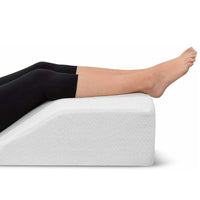 Leg Elevation Pillow supporting a person's legs raised at an angle on a white background