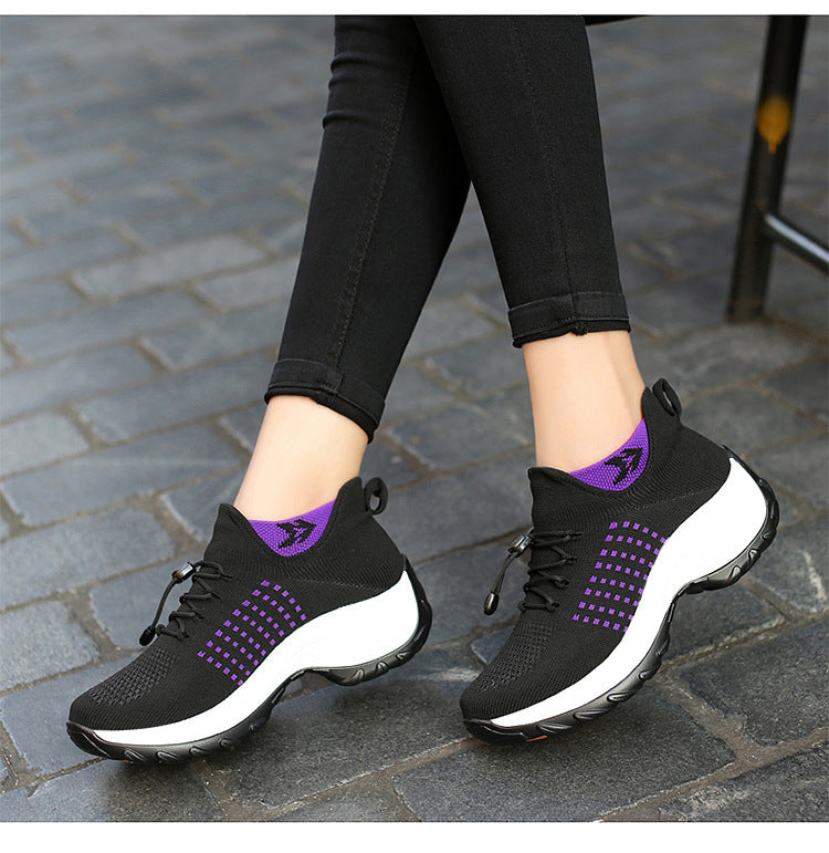 Black and purple Orthopaedic Comfort Shoes for Women on cobblestone pavement