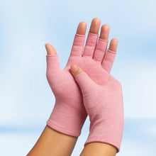 Load image into Gallery viewer, Pair of pink Therapeutic Heat Gloves raised against light blue background
