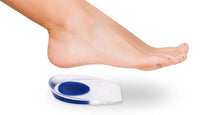 Load image into Gallery viewer, Bare foot hovering above a single clear silicone gel heel cup with blue centre pad on a white background