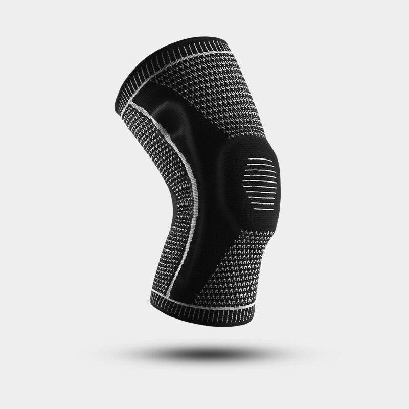 Black and grey Ultra Knee Brace floating on white background, angled side view