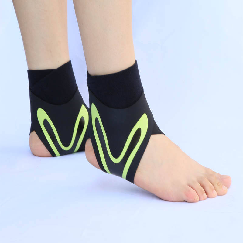 Pair of black and green Plantar X Wrap ankle wraps worn on both feet