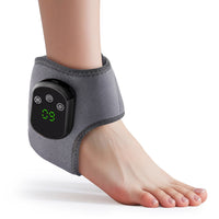 Grey wireless electric heating ankle wrap on bare foot with orange heat glow graphic on white background