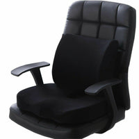 Black lumbar support and seat cushion set fitted to a black leather office chair