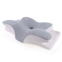 Neck and shoulder support pillow with grey memory foam top and white quilted base, angled front view