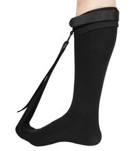 Load image into Gallery viewer, Black plantar fasciitis night splint sock with adjustable foot tension strap, side view on lower leg
