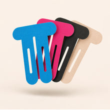 Load image into Gallery viewer, Knee support adhesive tape patches in four colours beside a pink taped knee
