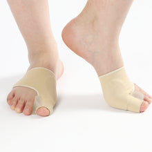 Load image into Gallery viewer, Two feet wearing beige bunion corrector splints shown from front and side
