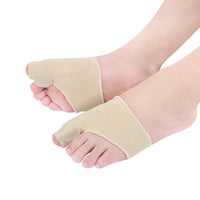 Two feet side by side wearing beige bunion corrector toe splint straighteners