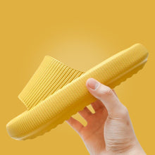 Load image into Gallery viewer, Hand holding yellow Cloud Slide against matching yellow background

