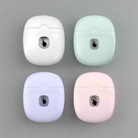 Four electric nail clippers in white, mint, lavender and pink colour variants shown from above