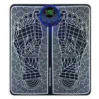 EMS Foot Massage Mat flat lay showing black patterned surface and illuminated LCD controller
