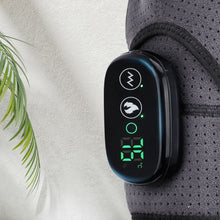 Load image into Gallery viewer, Close-up of black oval LED controller on grey heated compression shoulder brace showing green display

