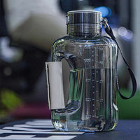 Large clear hydrogen water bottle generator with volume markings and carry strap