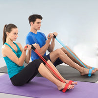 Man and woman seated on yoga mats using resistance bands in blue and red for rowing exercises