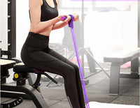 Woman seated on gym bench pulling purple Multifunction Resistance Band handles toward her torso