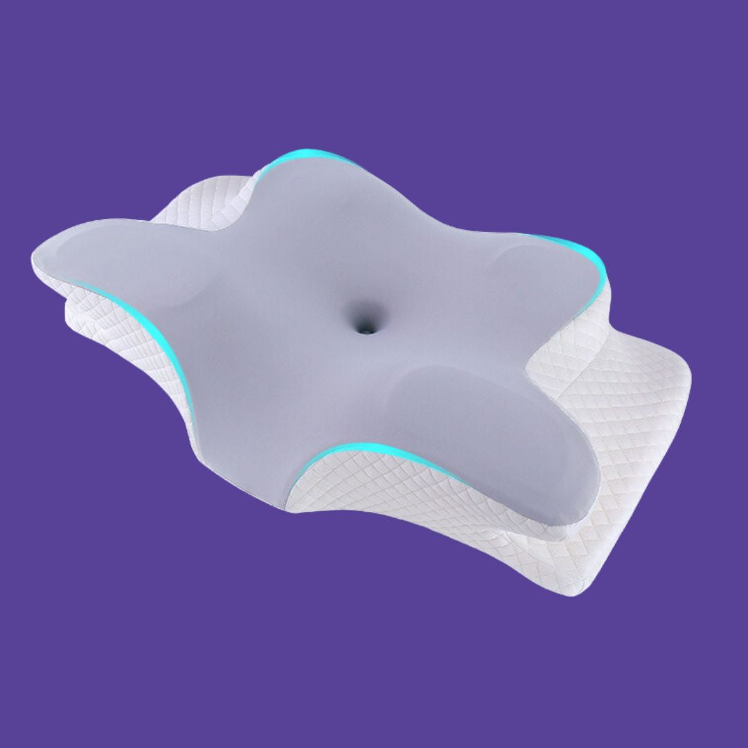 Neck and shoulder support pillow with contoured grey foam top and white quilted base on purple background