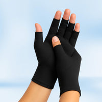 Pair of black Therapeutic Heat Gloves raised against light blue background