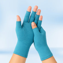 Load image into Gallery viewer, Pair of teal Therapeutic Heat Gloves raised against light blue background
