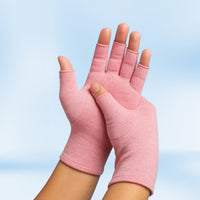 Pair of pink Therapeutic Heat Gloves raised against light blue background