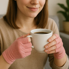 Load image into Gallery viewer, Woman wearing pink Therapeutic Heat Gloves holding white coffee cup
