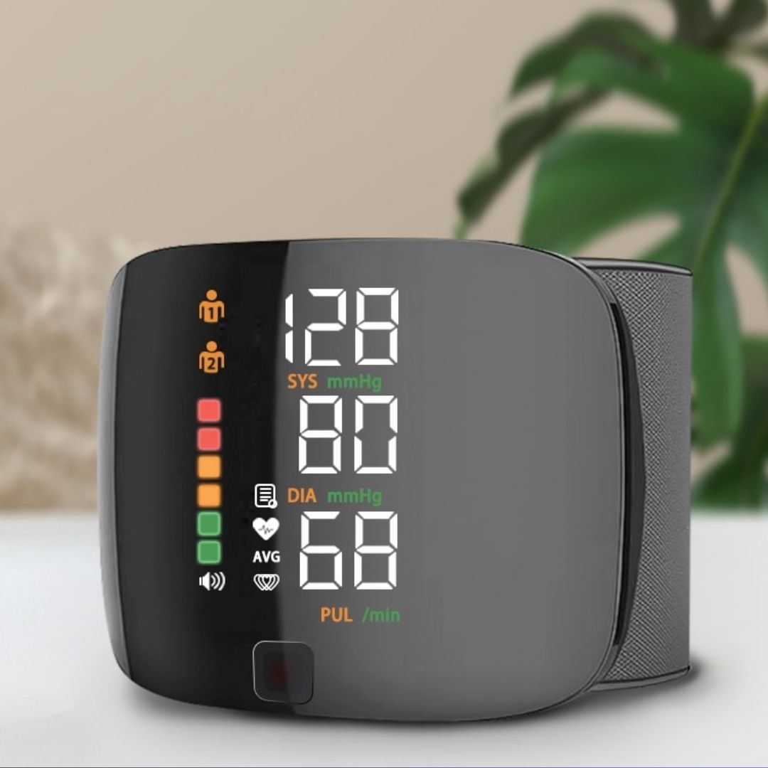 Front view of black wrist blood pressure monitor showing coloured indicator lights and SYS, DIA, pulse display