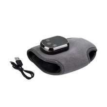 Load image into Gallery viewer, Ankle heating wrap laid flat beside a USB charging cable on white background
