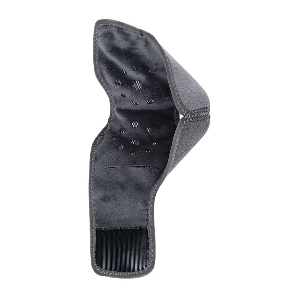 Interior of ankle heating wrap laid flat, showing black heating pad with ventilation holes and velcro strap
