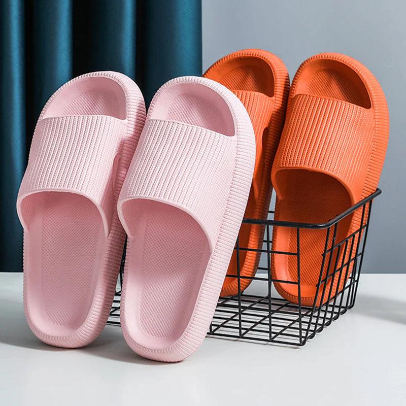 Pink and orange Cloud Slides pairs beside wire storage basket