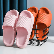 Load image into Gallery viewer, Pink and orange Cloud Slides pairs beside wire storage basket
