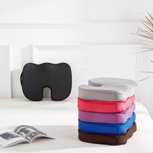Load image into Gallery viewer, Six coccyx cushions stacked showing grey, pink, purple, blue and brown colour options
