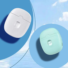 Load image into Gallery viewer, White and mint green electric nail clipper charging cases shown front-on against a blue sky background
