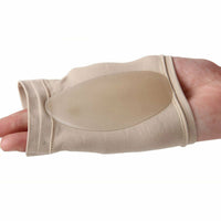 Hand holding beige Foot Arch Support Sleeve showing oval silicone gel pad inside