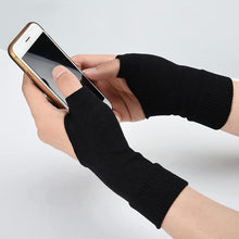 Load image into Gallery viewer, Hands wearing black fingerless wrist support gloves scrolling on a smartphone
