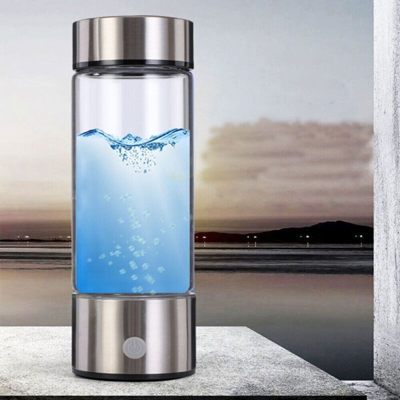 Silver hydrogen water bottle generator with blue water and rising bubbles inside