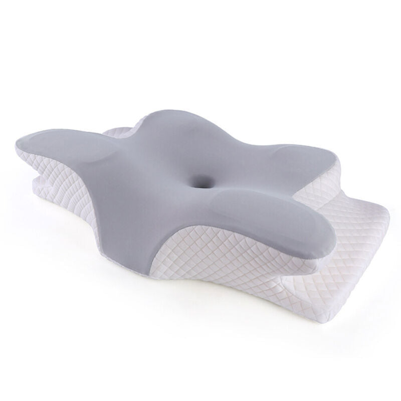 Neck and shoulder support pillow with grey memory foam top and white quilted base, angled front view