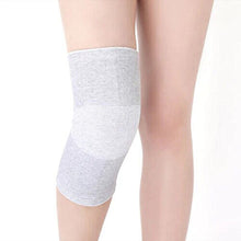 Load image into Gallery viewer, Grey bamboo compression knee support sleeve worn on a single leg, front view
