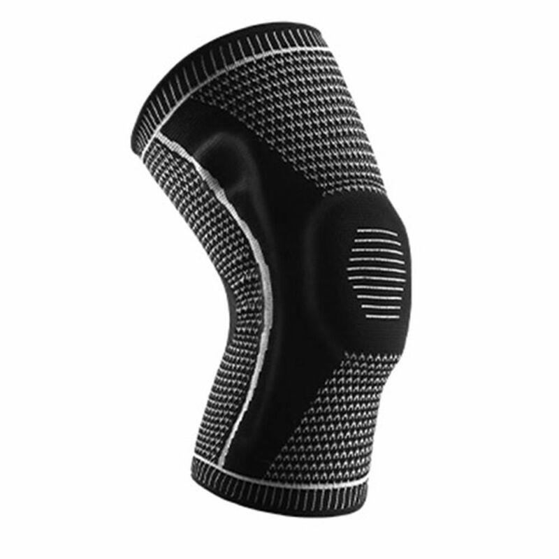 Single black and grey Ultra Knee Brace on white background, front three-quarter view